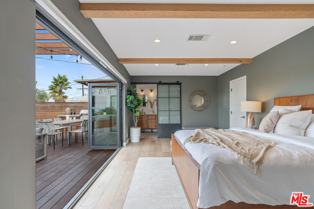 1645 South Sierra Bonita Avenue Los Angeles, CA 90019 - Photo 40 of 62 a bed room with a bed and a table