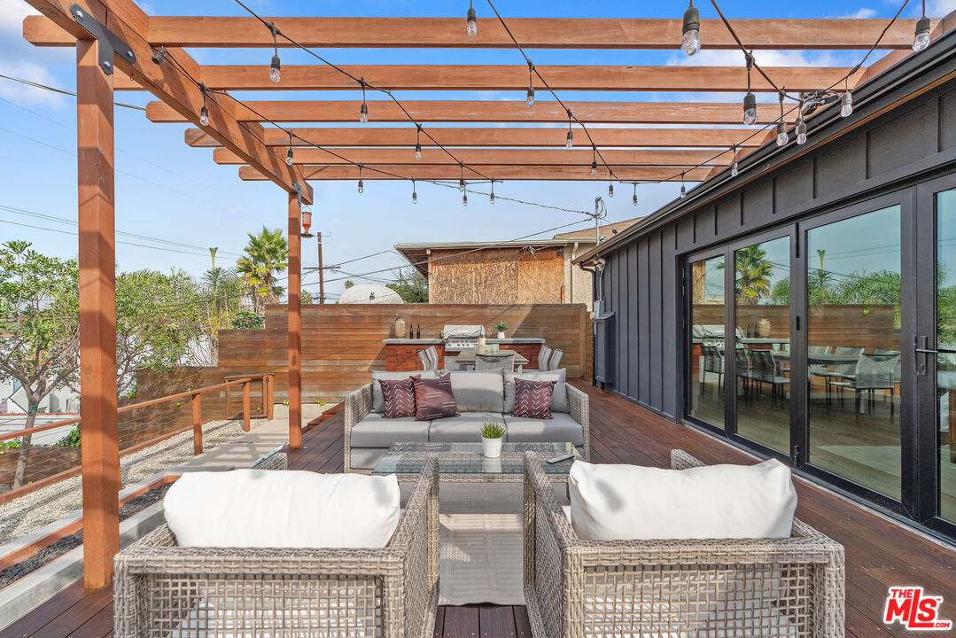 1645 South Sierra Bonita Avenue Los Angeles, CA 90019 - Photo 44 of 62 a view of an outdoor dining space with a patio
