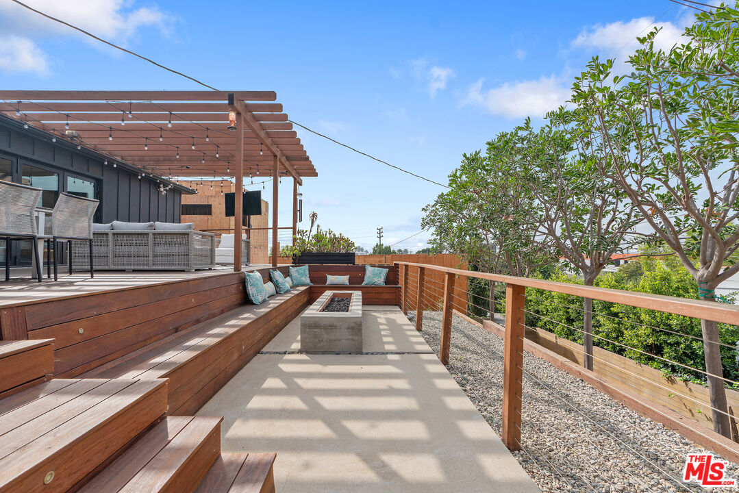 1645 South Sierra Bonita Avenue Los Angeles, CA 90019 - Photo 51 of 62 a view of house with swimming pool and sitting area