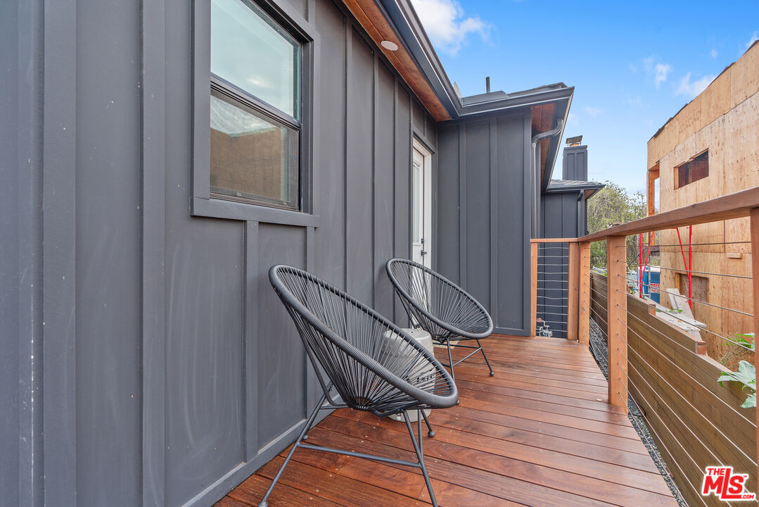 1645 South Sierra Bonita Avenue Los Angeles, CA 90019 - Photo 55 of 62 a view of balcony and wooden floor