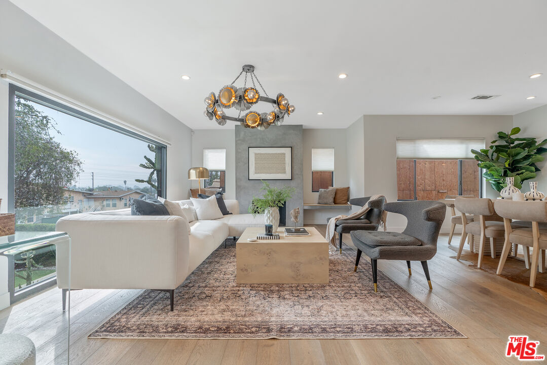 1645 South Sierra Bonita Avenue Los Angeles, CA 90019 - Photo 7 of 62 a living room with furniture and a large window