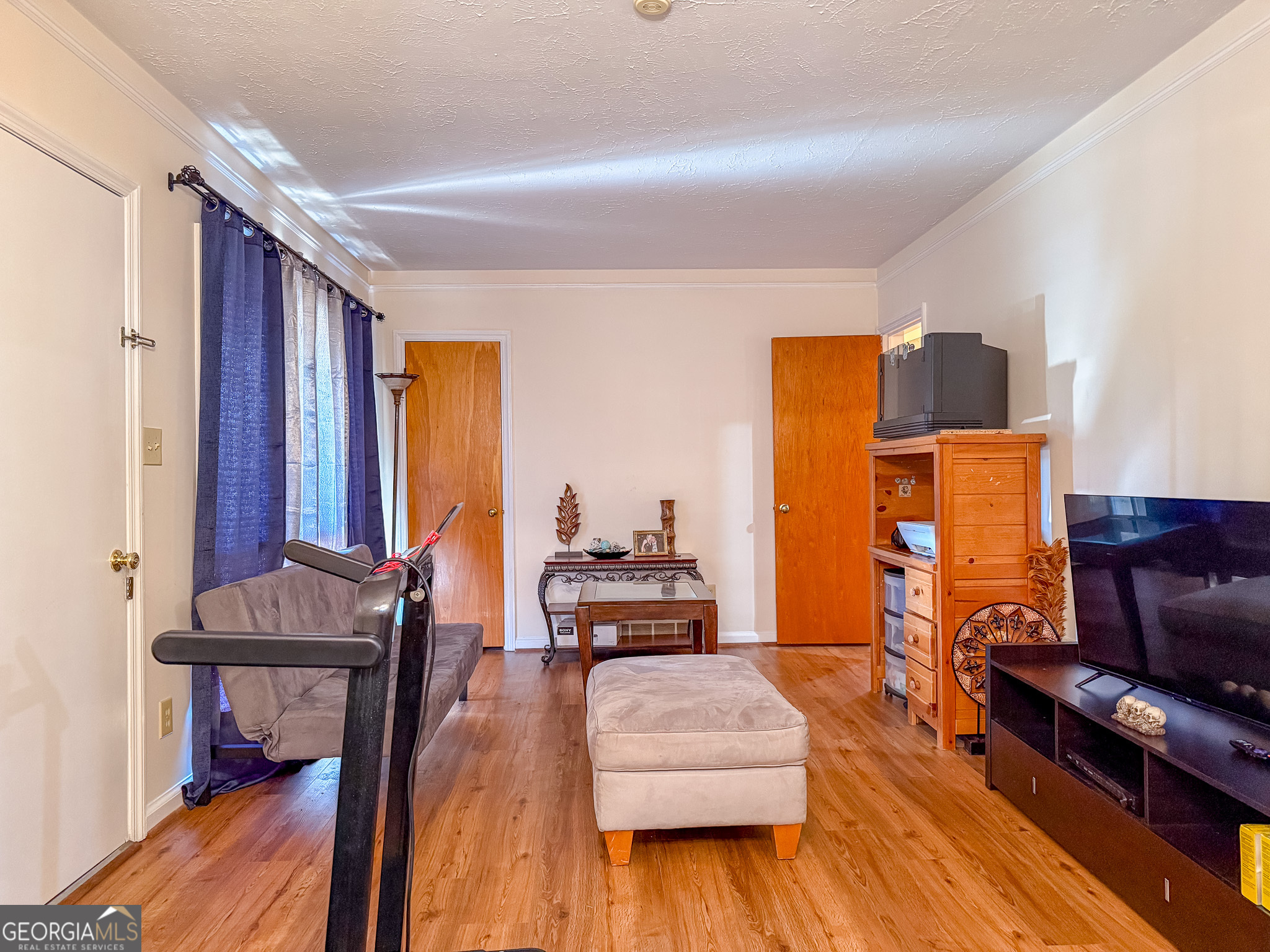 4303 Armour Road Columbus, GA 31904 - Photo 3 of 16 a living room with furniture and wooden floor