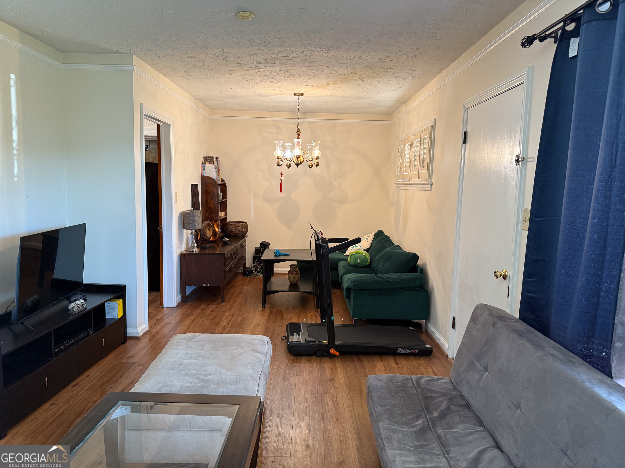 4303 Armour Road Columbus, GA 31904 - Photo 4 of 16 a living room with furniture and a flat screen tv