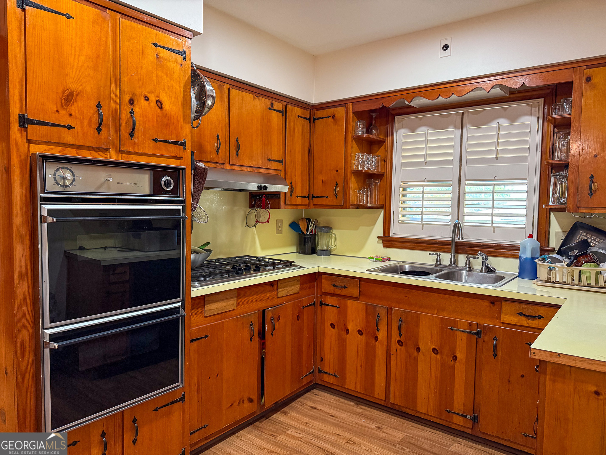 4303 Armour Road Columbus, GA 31904 - Photo 5 of 16 a kitchen with stainless steel appliances a stove sink and cabinets