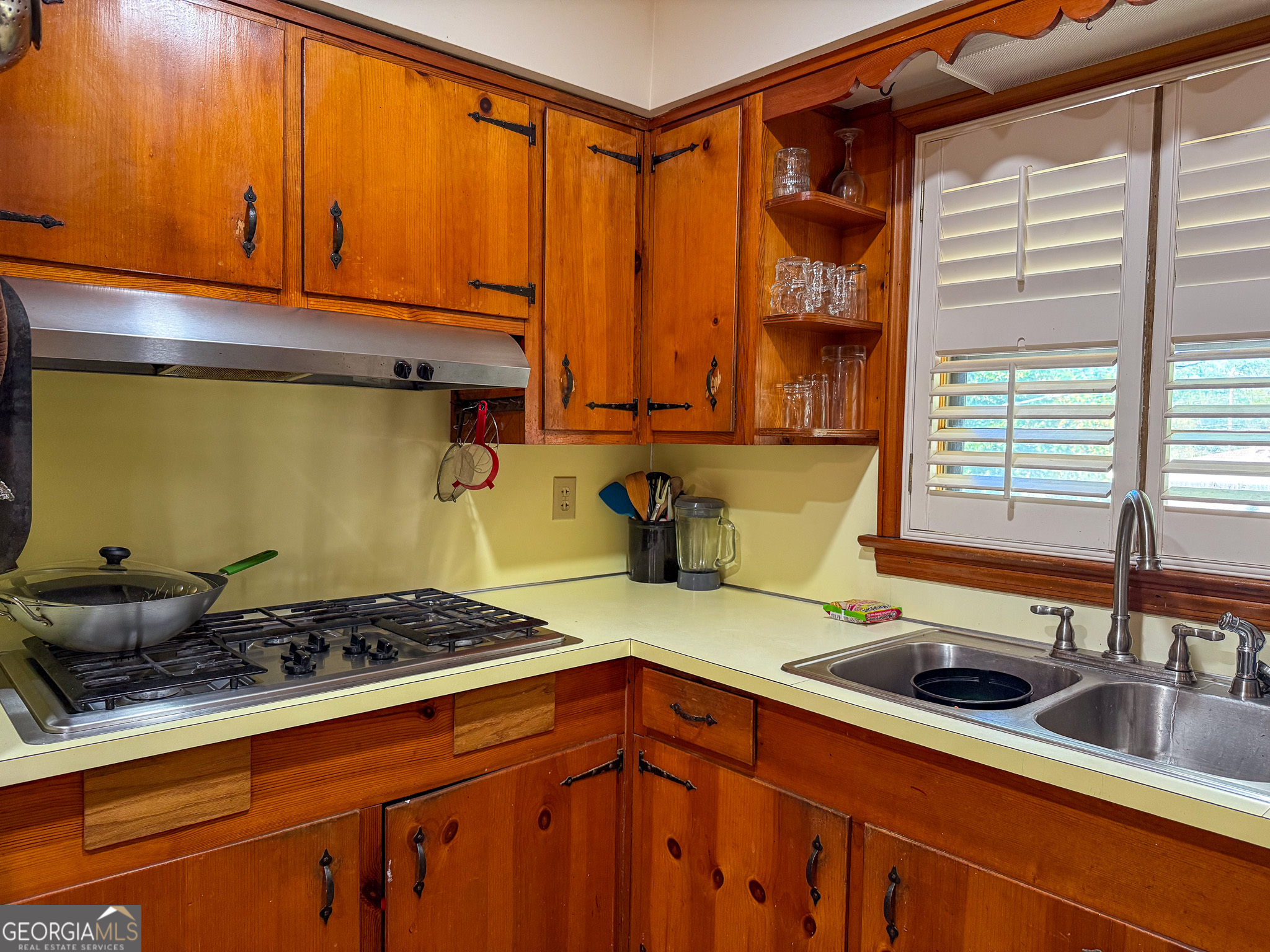 4303 Armour Road Columbus, GA 31904 - Photo 6 of 16 a kitchen with a sink a stove and cabinets