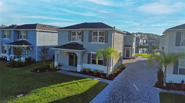 an aerial view of a house with a garden