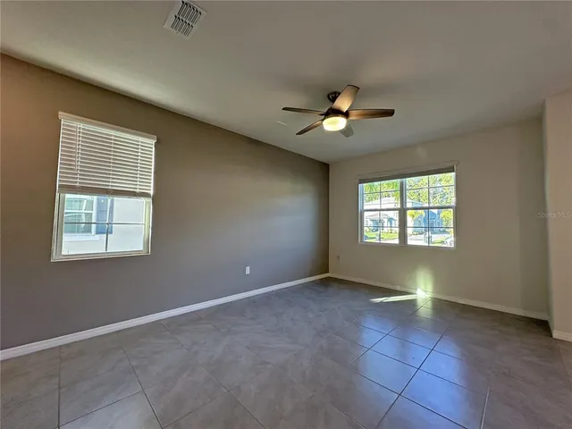 a view of an empty room with a window