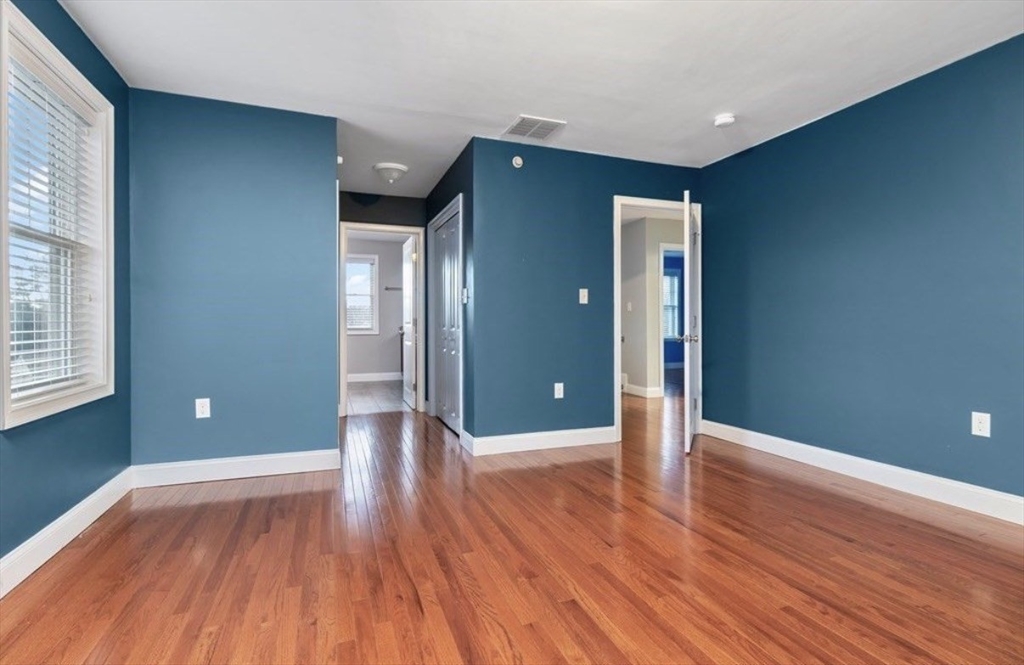 38 Webster Street, Unit 2 Needham, MA 02494 - Photo 11 of 16 a view of empty room with wooden floor and window
