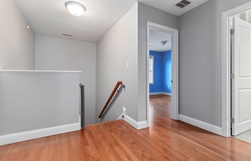 38 Webster Street, Unit 2 Needham, MA 02494 - Photo 9 of 16 a view of a hallway with wooden floor