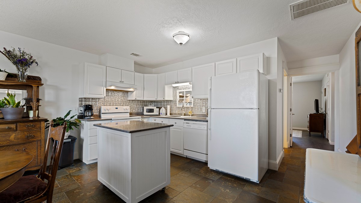 T-5 Providence Road Hearne, TX 77859 - Photo 11 of 39 a kitchen with cabinets and stainless steel appliances