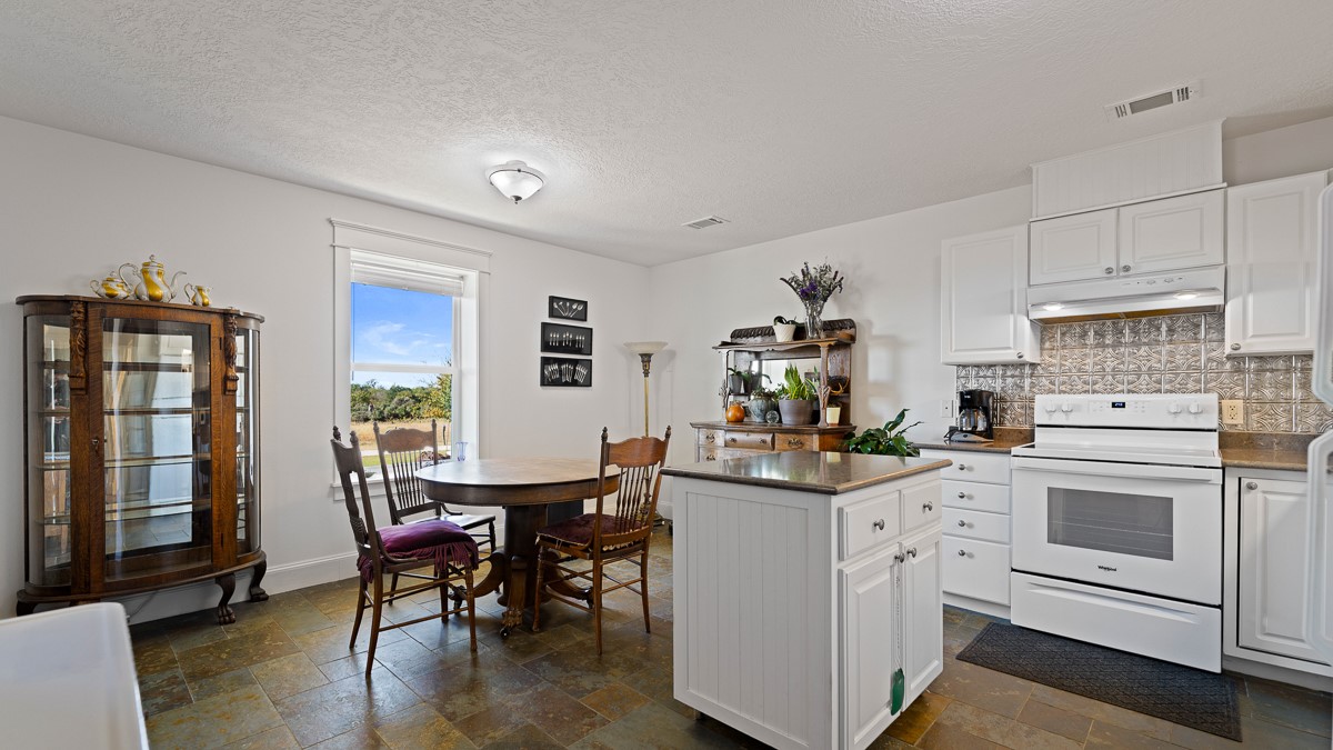 T-5 Providence Road Hearne, TX 77859 - Photo 13 of 39 a view of a dining table and chairs in a room
