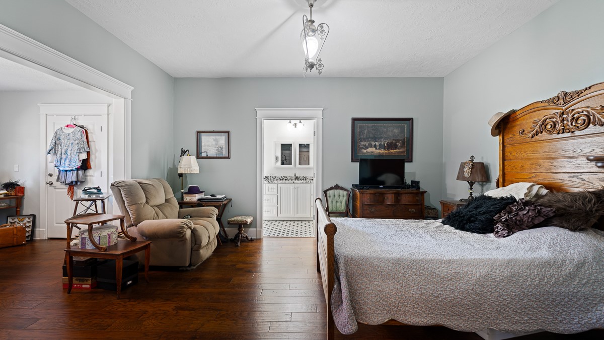 T-5 Providence Road Hearne, TX 77859 - Photo 15 of 39 a bedroom with a bed and wooden floor