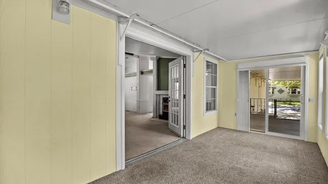 a view of a hallway with wooden shelves