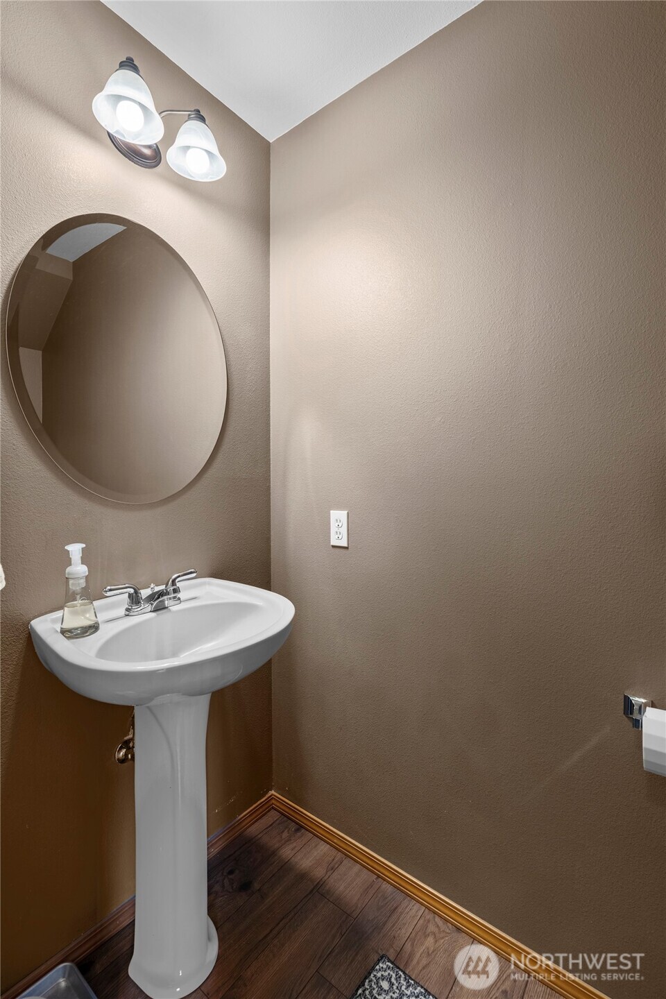 3349 68th Avenue Southwest Olympia, WA 98512 - Photo 14 of 36 a bathroom with a sink and mirror