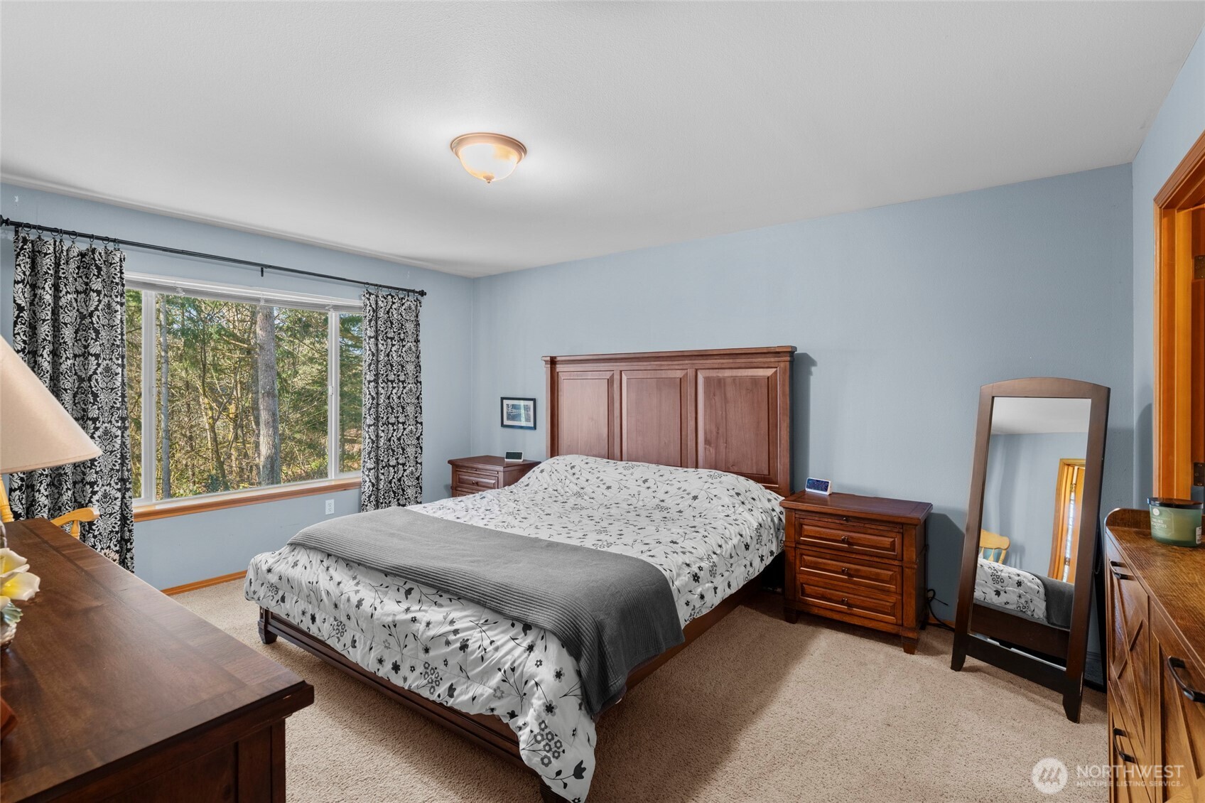 3349 68th Avenue Southwest Olympia, WA 98512 - Photo 16 of 36 a bedroom with a bed and a dresser next to a window