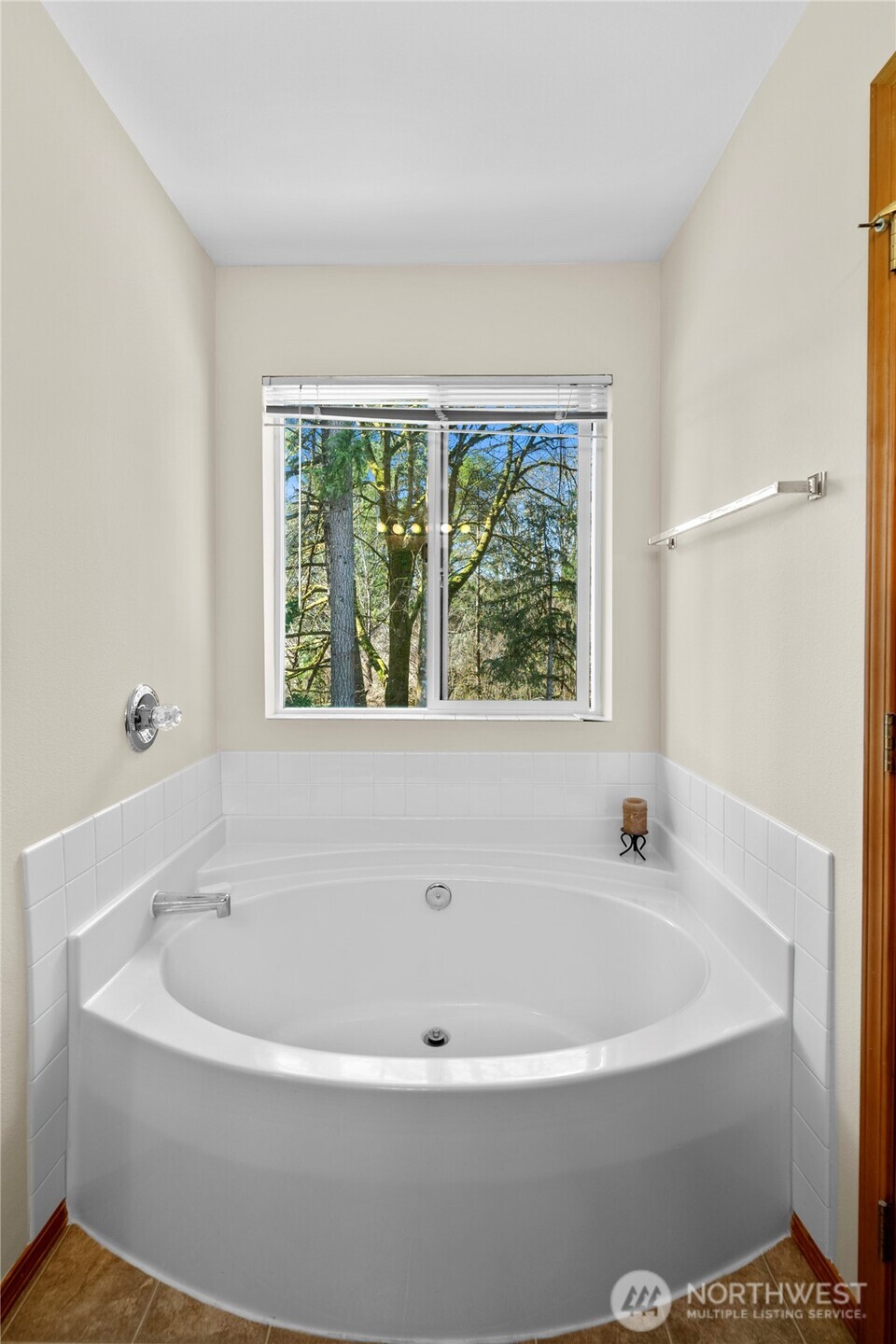 3349 68th Avenue Southwest Olympia, WA 98512 - Photo 19 of 36 a white bath tub sitting in a bathroom next to a window