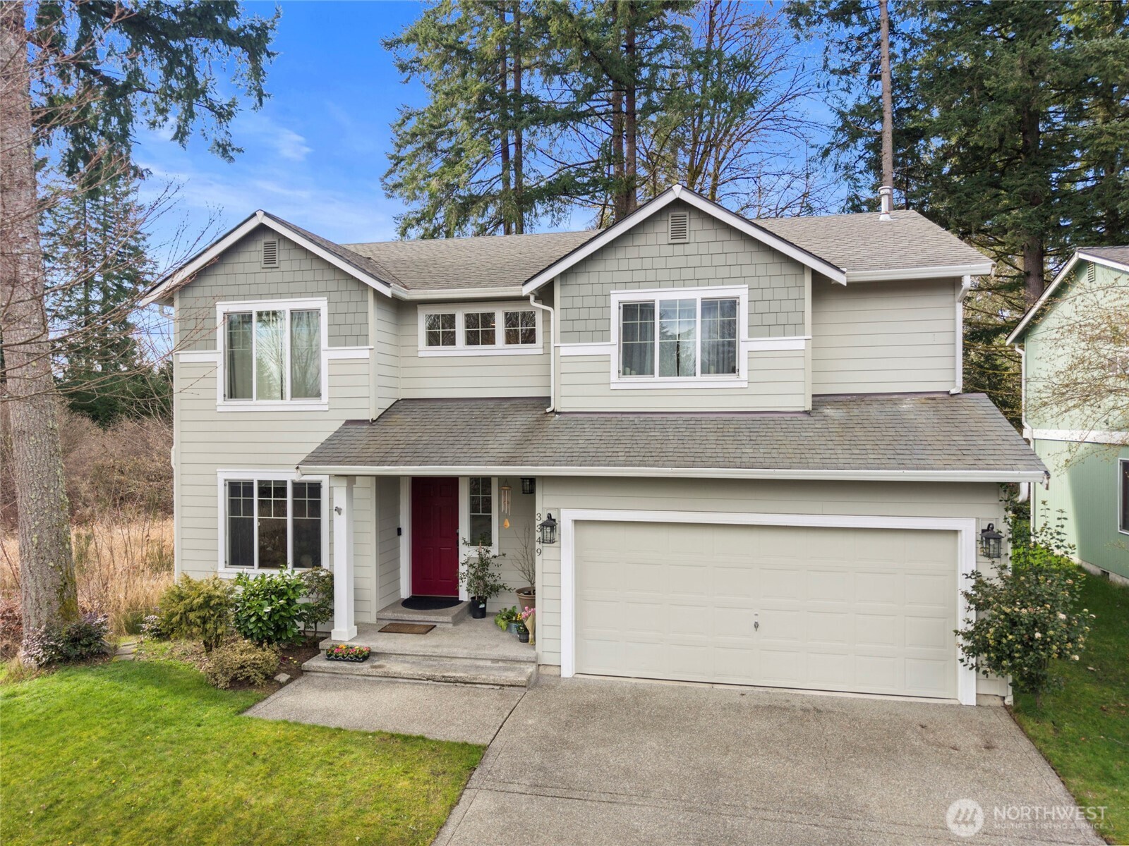 3349 68th Avenue Southwest Olympia, WA 98512 - Photo 2 of 36 a front view of a house with a yard and garage