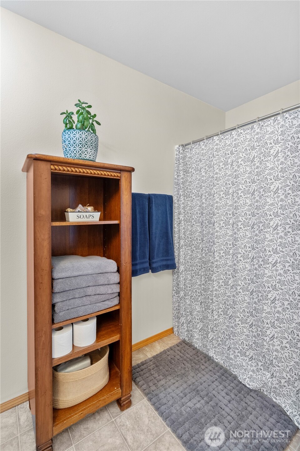 3349 68th Avenue Southwest Olympia, WA 98512 - Photo 21 of 36 a bedroom with a bed and a potted plant