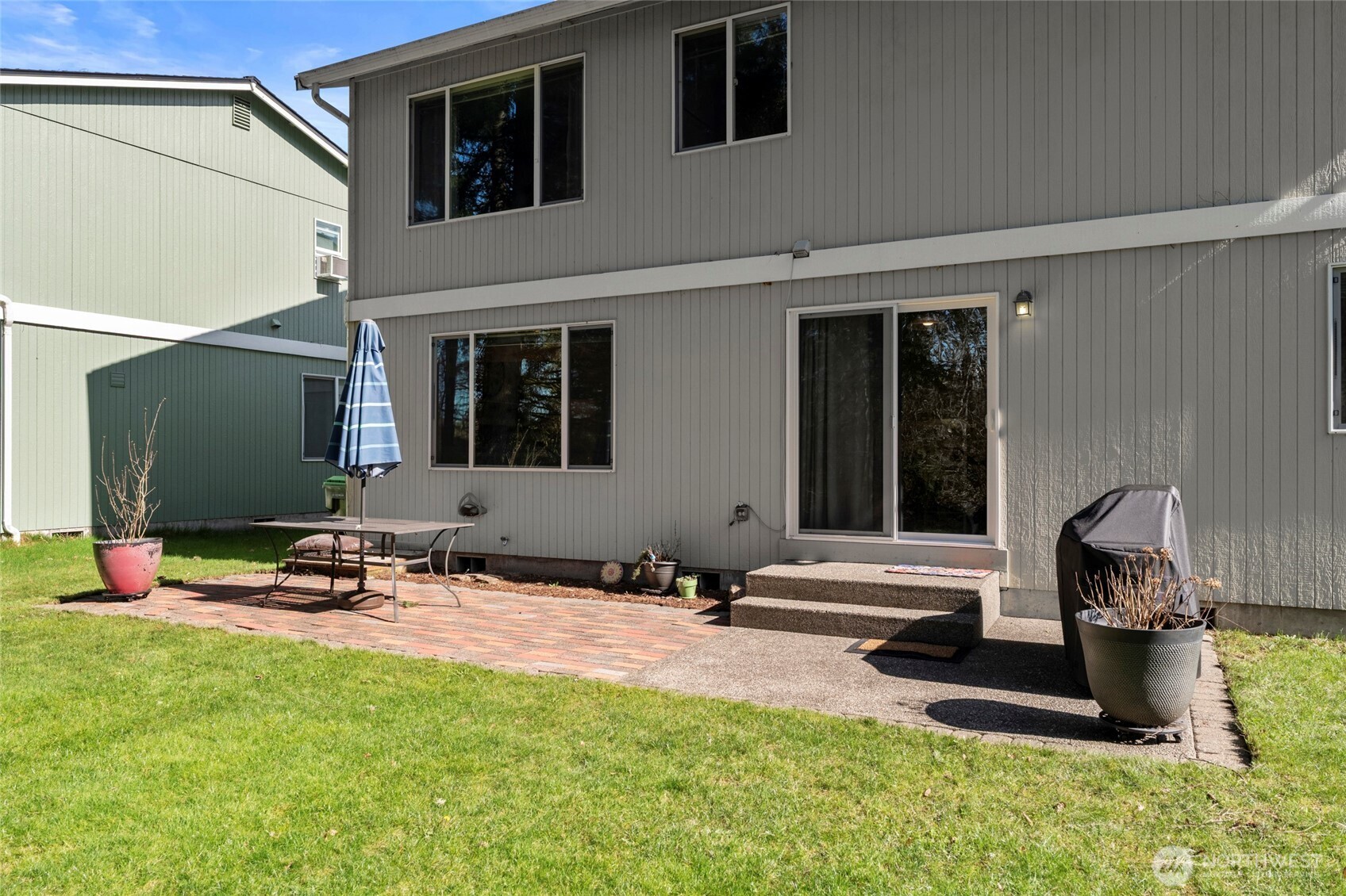 3349 68th Avenue Southwest Olympia, WA 98512 - Photo 30 of 36 a view of a patio with a table and chairs a barbeque