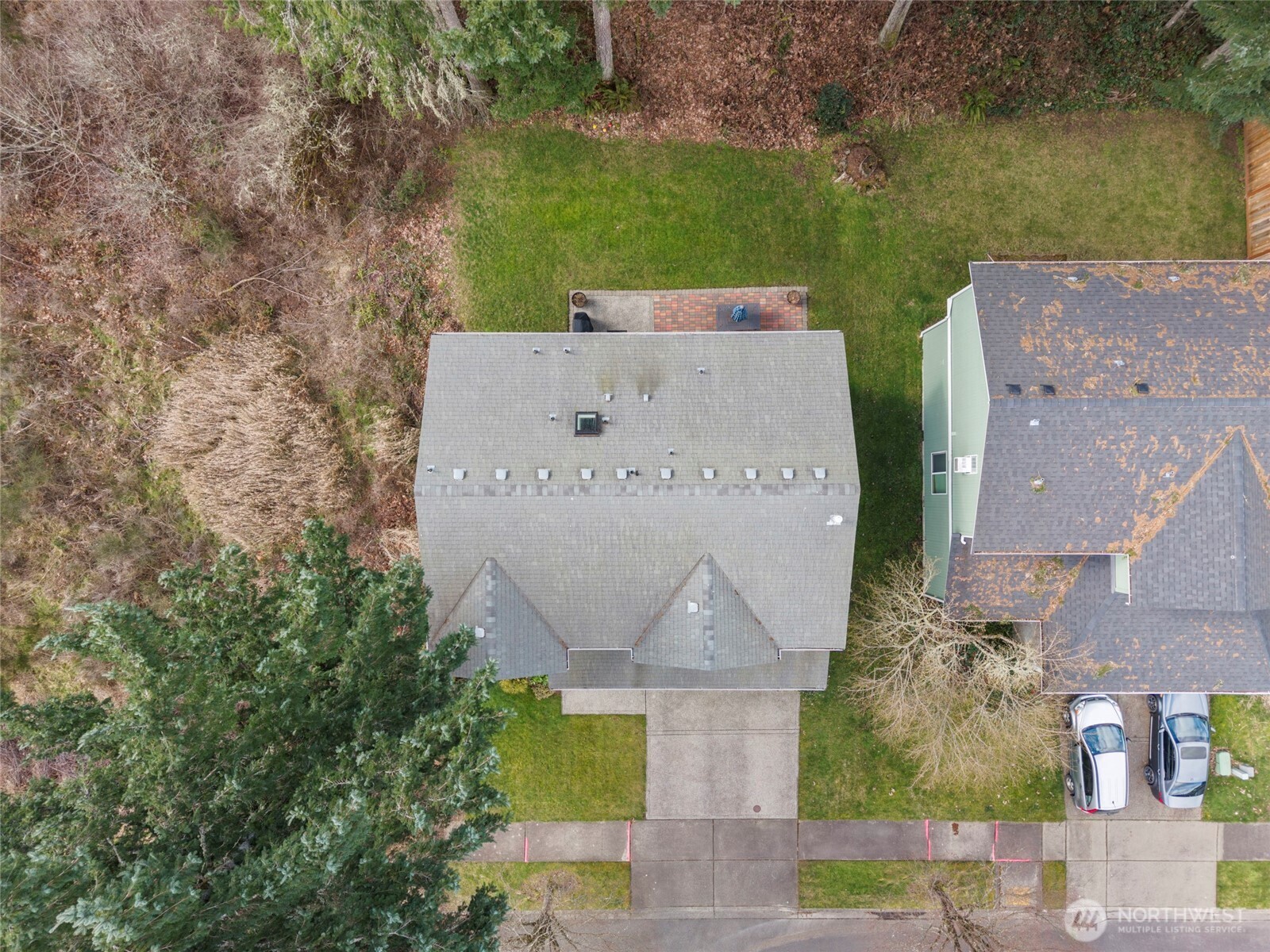 3349 68th Avenue Southwest Olympia, WA 98512 - Photo 4 of 36 an aerial view of a house with swimming pool and large trees