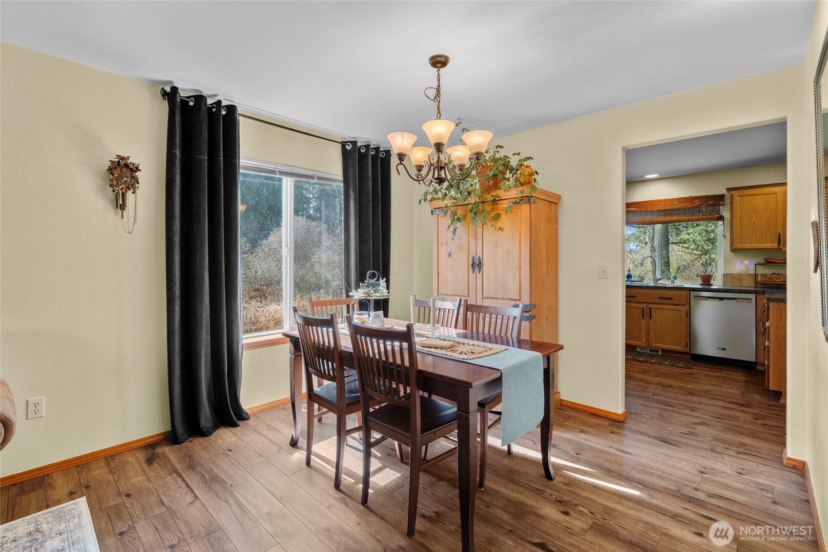 3349 68th Avenue Southwest Olympia, WA 98512 - Photo 7 of 36 a view of a dining room with furniture wooden floor and chandelier