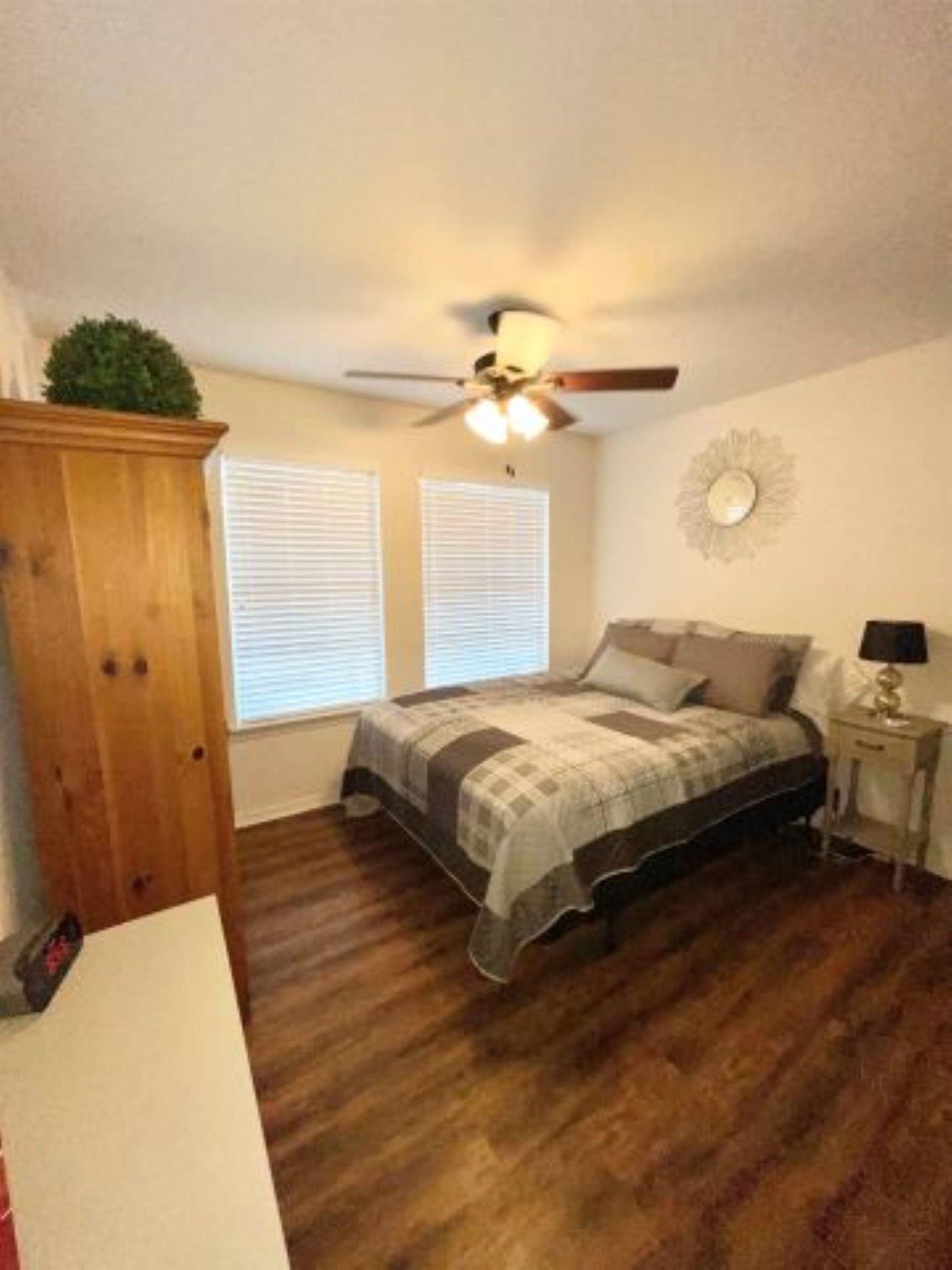 602 Sycamore Road Burnet, TX 78611 - Photo 16 of 26 a bedroom with a bed and a window