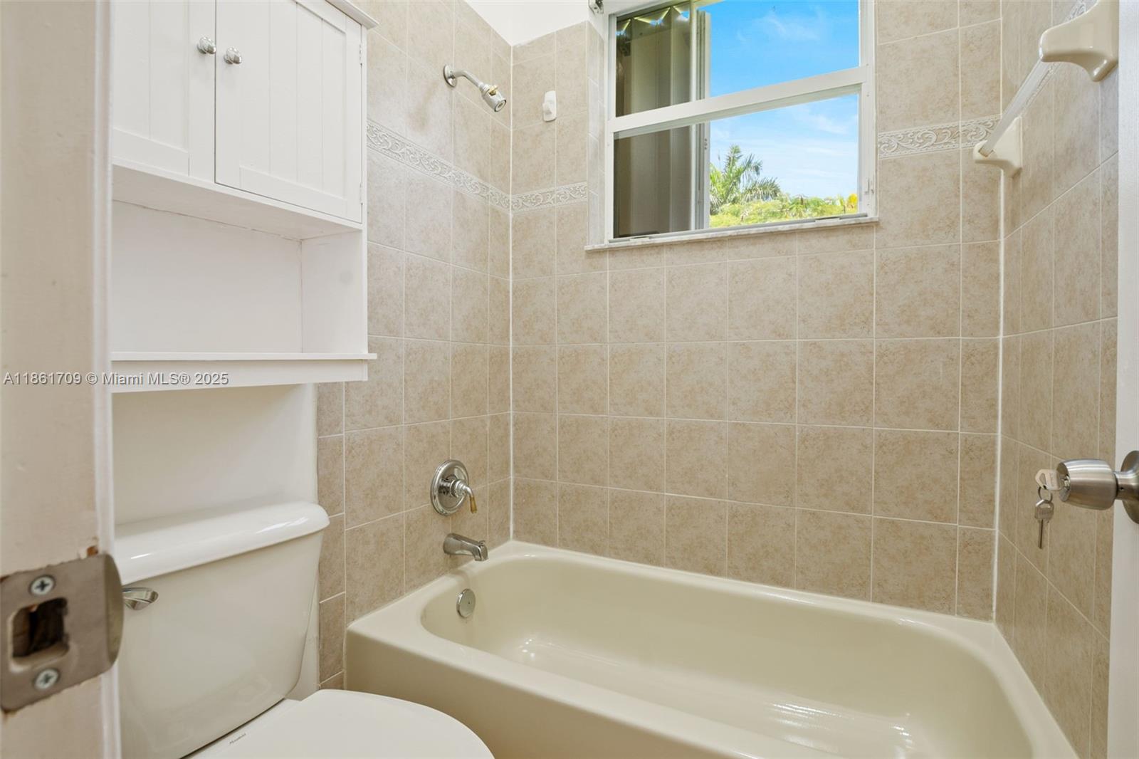 5168 Southwest 157th Avenue Miramar, FL 33027 - Photo 21 of 30 a white bath tub sitting next to a white toilet