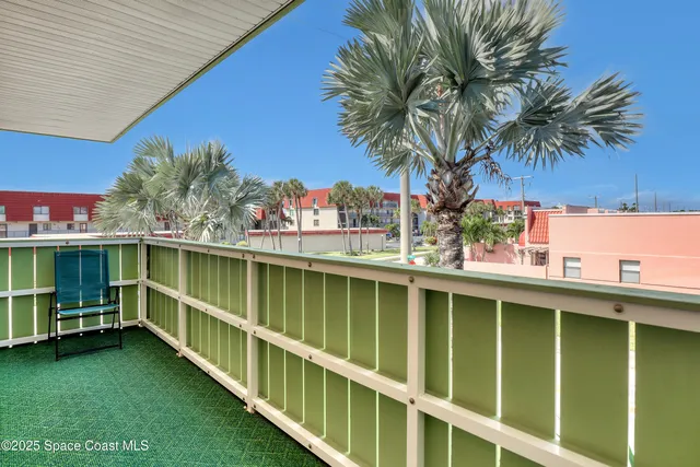 a bedroom with a bed and a dresser next to a window