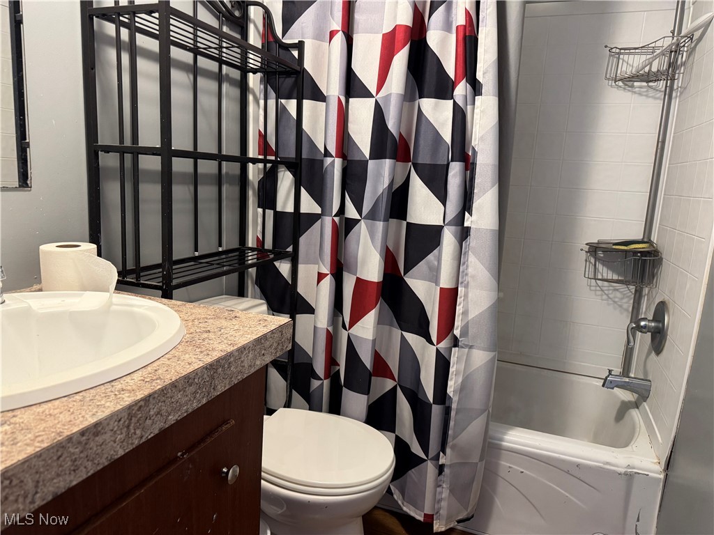 20 Eddie Road Madison, OH 44057 - Photo 5 of 9 Full bathroom featuring shower / bath combination with curtain and vanity