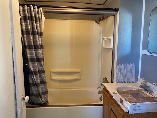 518 East Cleveland Street Spring Valley, IL 61362 - Photo 8 of 9 a bathroom with a granite countertop sink and a mirror