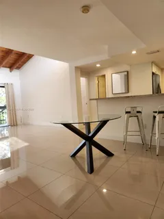a view of a livingroom with furniture and a rug