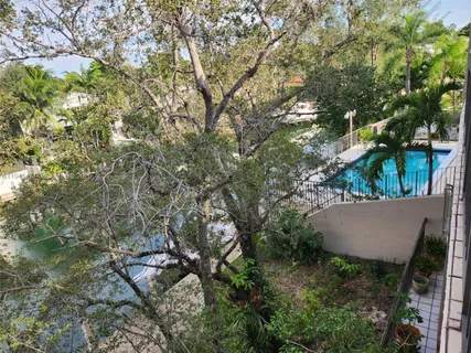 an aerial view of a house with yard and outdoor seating