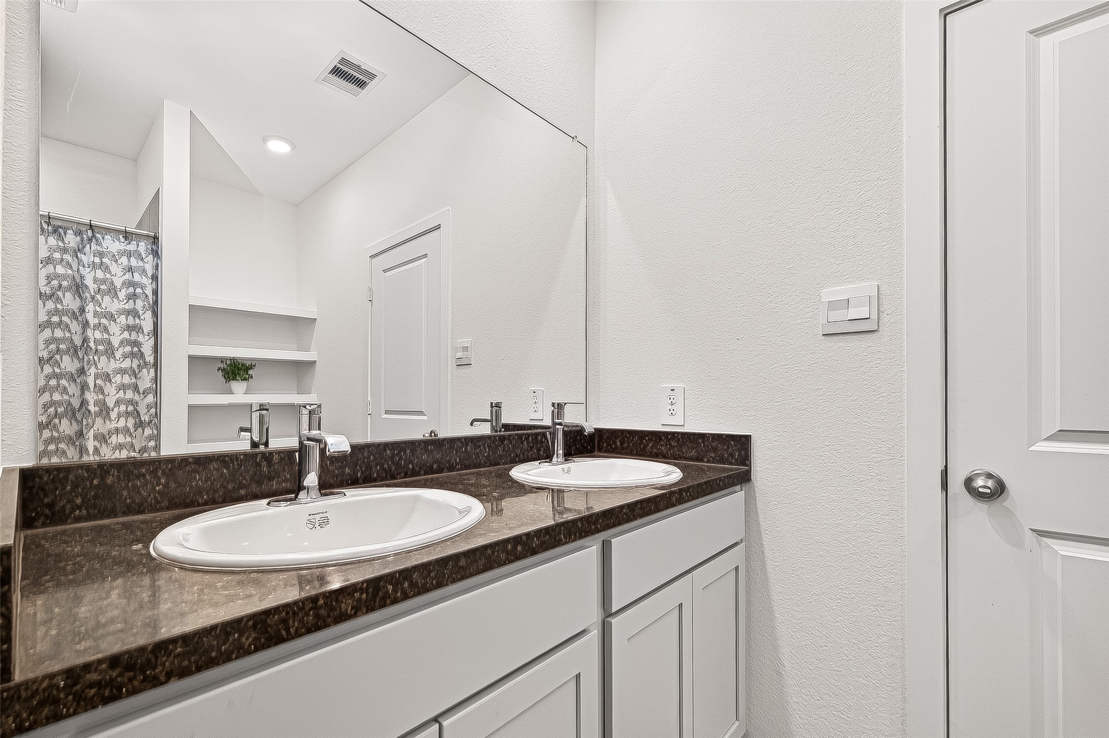5442 Pinetree Cres Lane Spring, TX 77373 - Photo 12 of 24 The primary ensuite bath features dual sinks, walk in shower, built in storage and a generously sized walk in closet