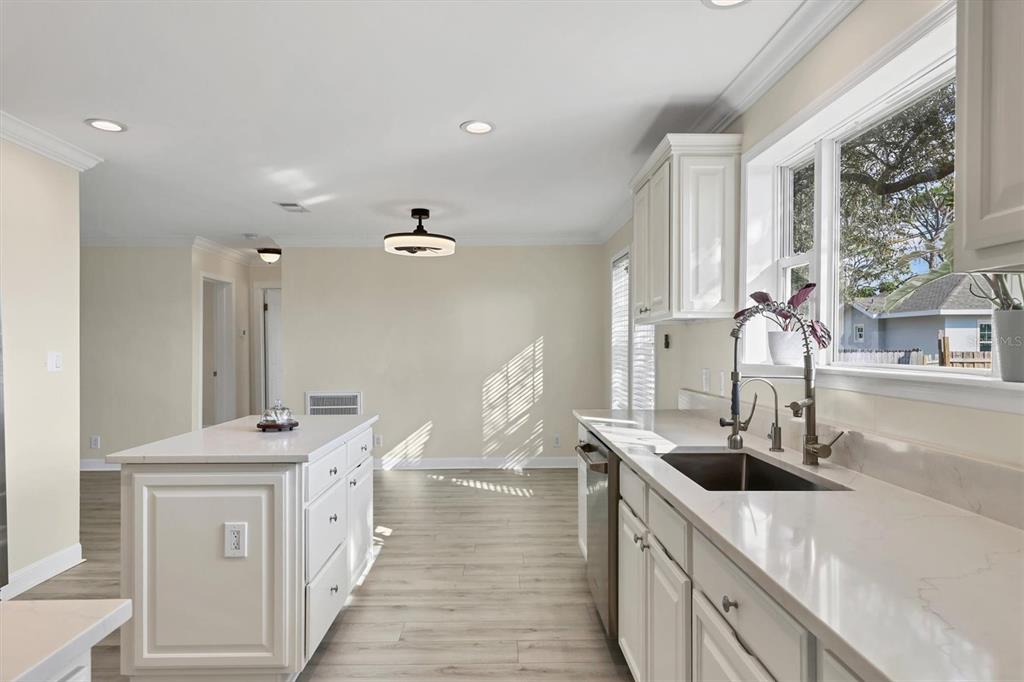 755 Colgate Road Venice, FL 34293 - Photo 11 of 53 a kitchen with stainless steel appliances a sink stove and cabinets