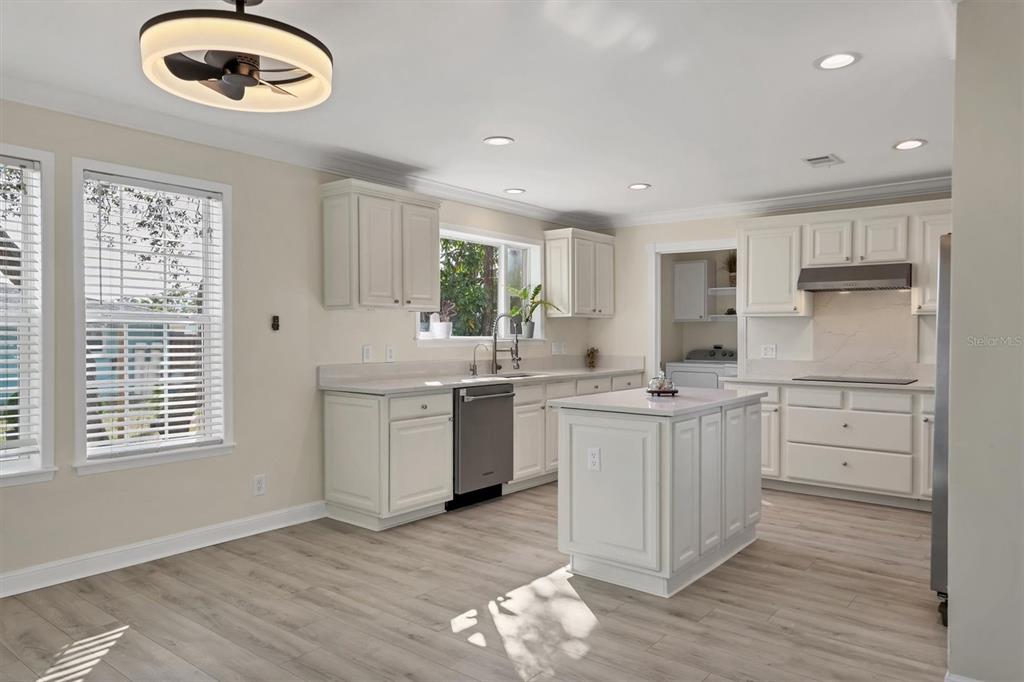 755 Colgate Road Venice, FL 34293 - Photo 13 of 53 a kitchen with a white cabinets and window