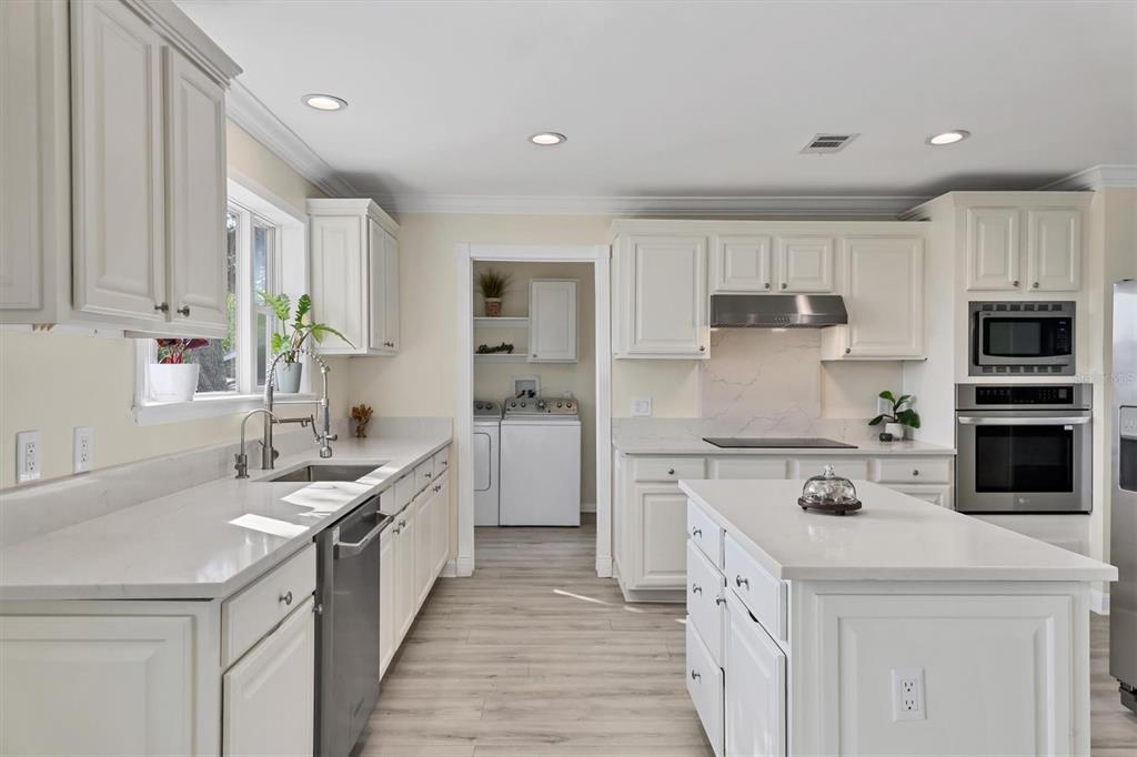 755 Colgate Road Venice, FL 34293 - Photo 14 of 53 a kitchen with a sink stove top oven and refrigerator