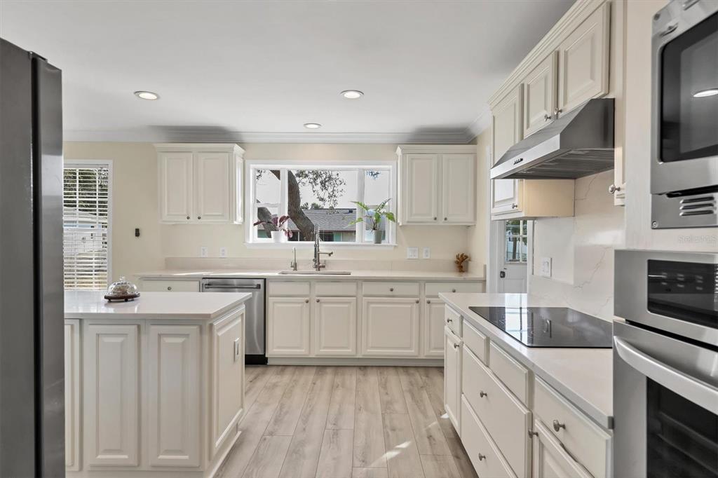 755 Colgate Road Venice, FL 34293 - Photo 15 of 53 a kitchen with a sink stove and cabinets