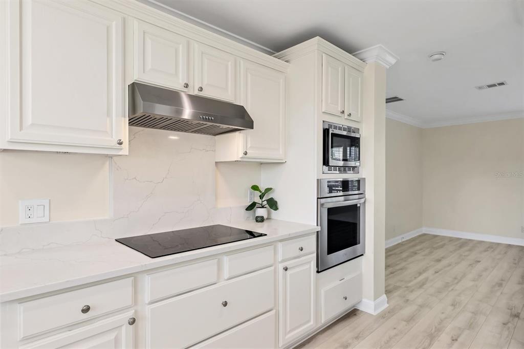 755 Colgate Road Venice, FL 34293 - Photo 16 of 53 a kitchen with stainless steel appliances white cabinets and a sink