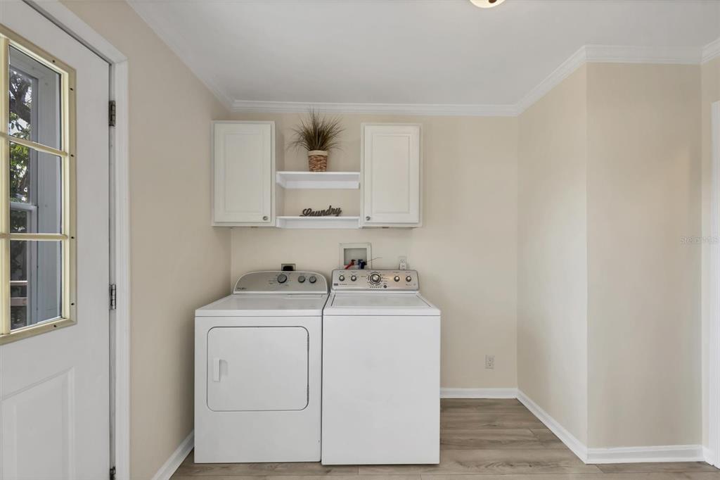 755 Colgate Road Venice, FL 34293 - Photo 17 of 53 a utility room with sink dryer and washer