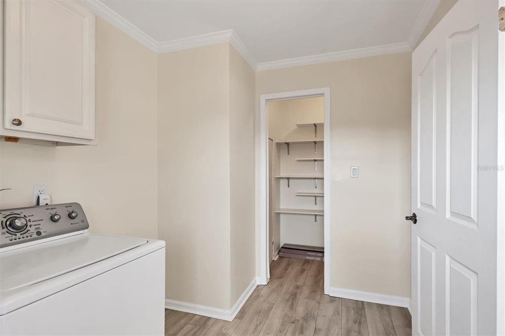 755 Colgate Road Venice, FL 34293 - Photo 18 of 53 a view of walk in closet with wooden floor