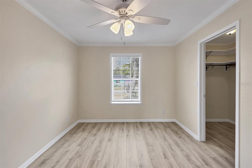 755 Colgate Road Venice, FL 34293 - Photo 30 of 53 a view of empty room with wooden floor and fan