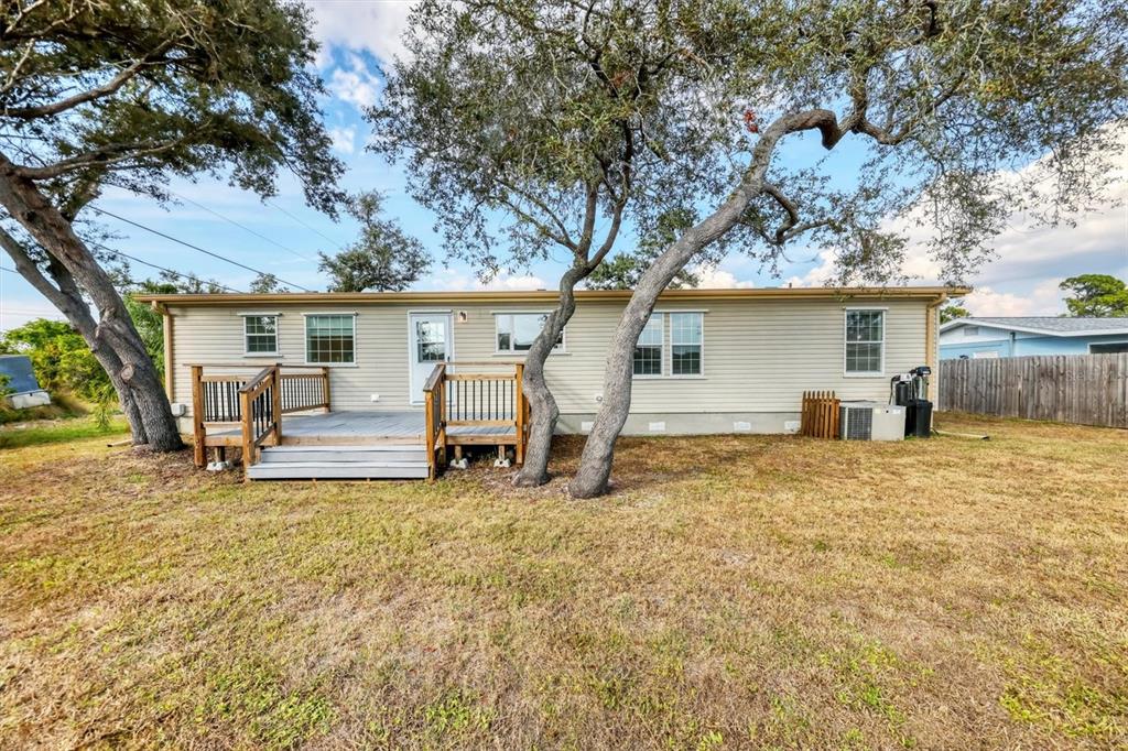 755 Colgate Road Venice, FL 34293 - Photo 33 of 53 a white house that has a tree in front of it