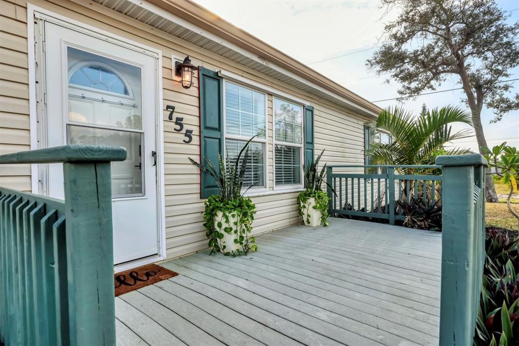 755 Colgate Road Venice, FL 34293 - Photo 4 of 53 a view of a house with a porch and furniture