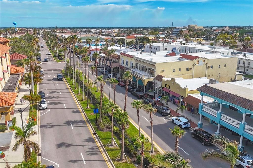 755 Colgate Road Venice, FL 34293 - Photo 49 of 53 an aerial view of a city with lots of residential buildings ocean and mountain view in back