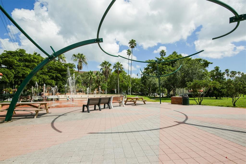 755 Colgate Road Venice, FL 34293 - Photo 51 of 53 a view of a swimming pool with a bench and trees in the background