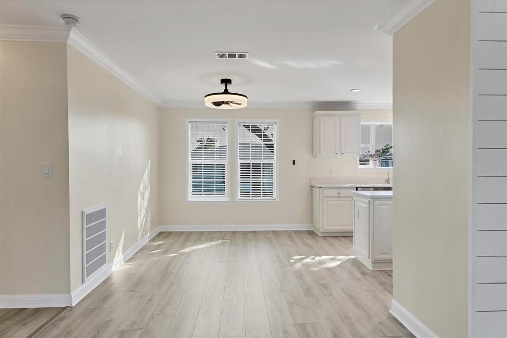 755 Colgate Road Venice, FL 34293 - Photo 10 of 53 an empty room with wooden floor and windows