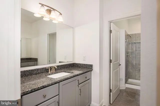 a bathroom with a shower and toilet