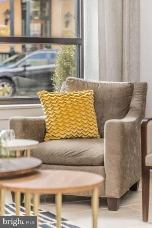 a kitchen with stainless steel appliances granite countertop a stove a sink and a refrigerator with wooden floor