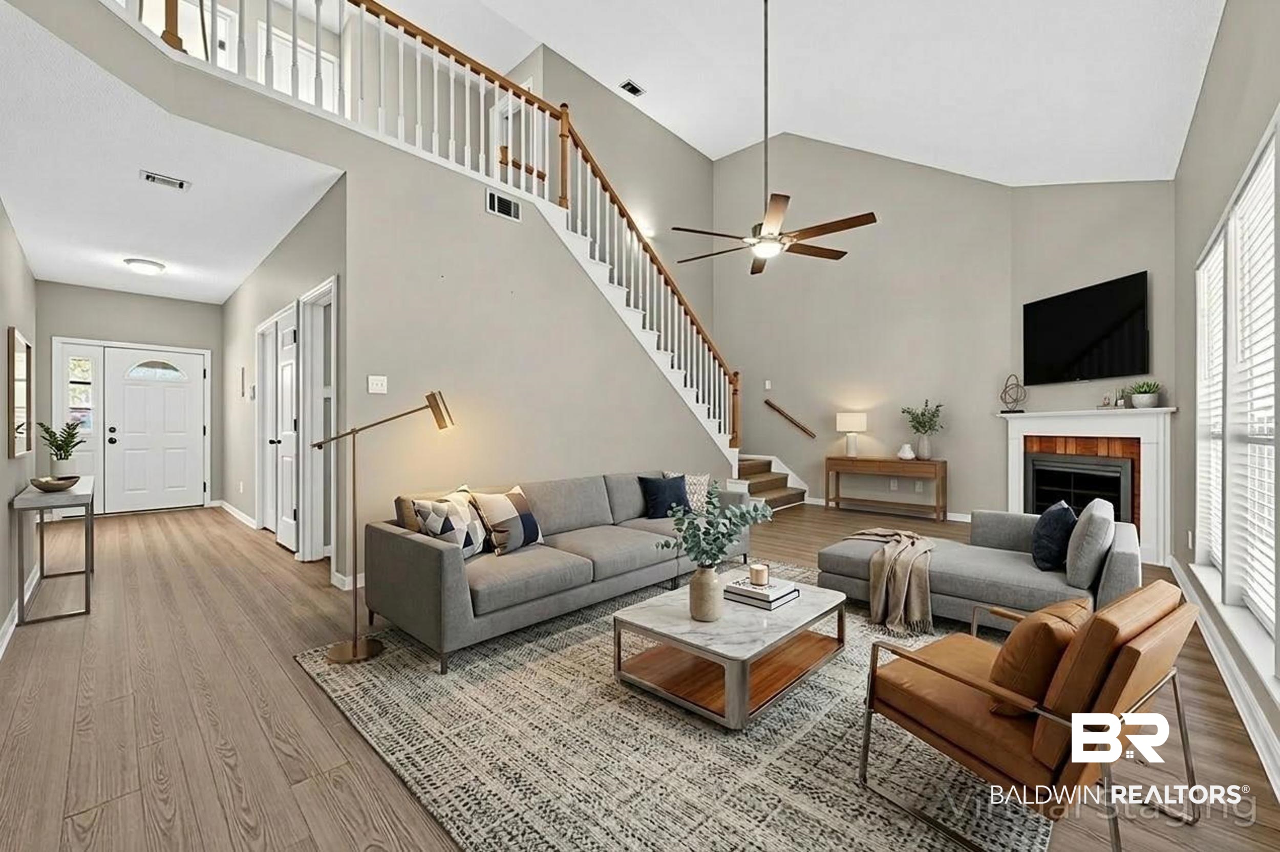 7050 Highpointe Place West Daphne, AL 36527 - Photo 29 of 66 Living room featuring healthy amount of natural light, light wood-style floors, a fireplace, and lofted ceiling