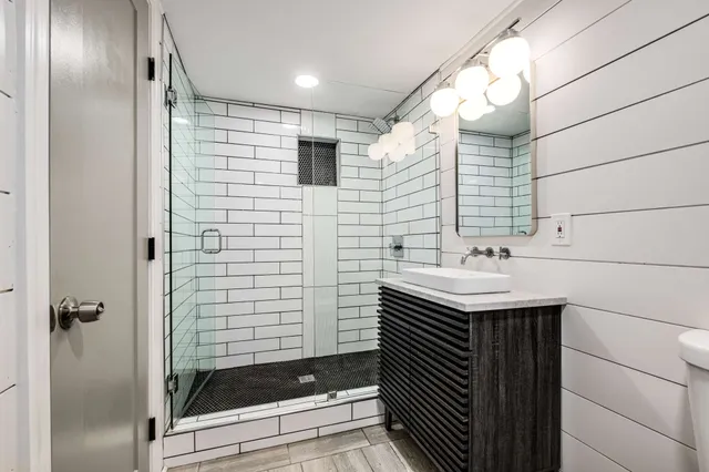 a bathroom with a sink and mirror